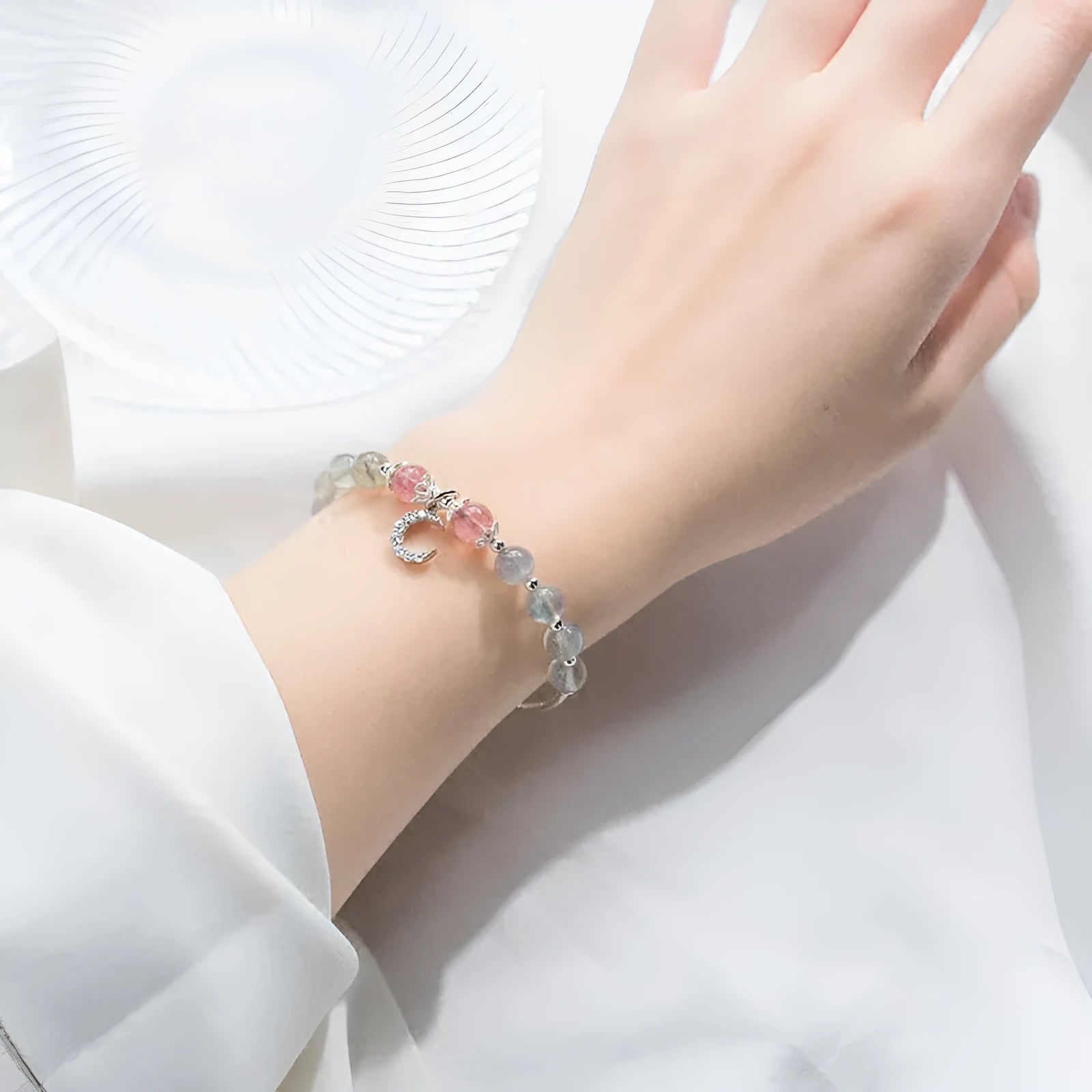 Moonstone handmade bracelet with crescent moon charm and adjustable extension chain.