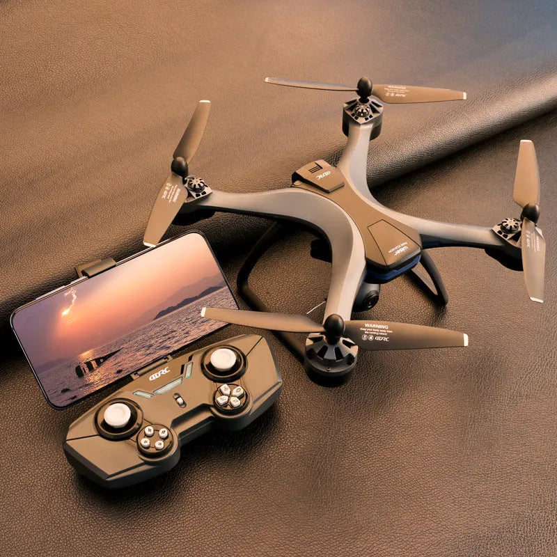GPS quadrocopter toy drone with remote controller, spare blades, and landing gear on white background