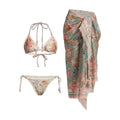Women's creamy-white floral print bikini set with top, briefs, and skirt laid flat.