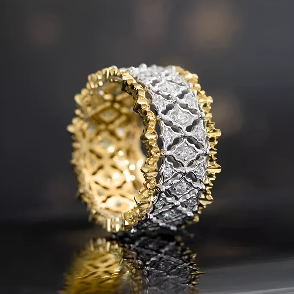 Gold two-tone geometric zircon ring on a copper band, showing round design detail.