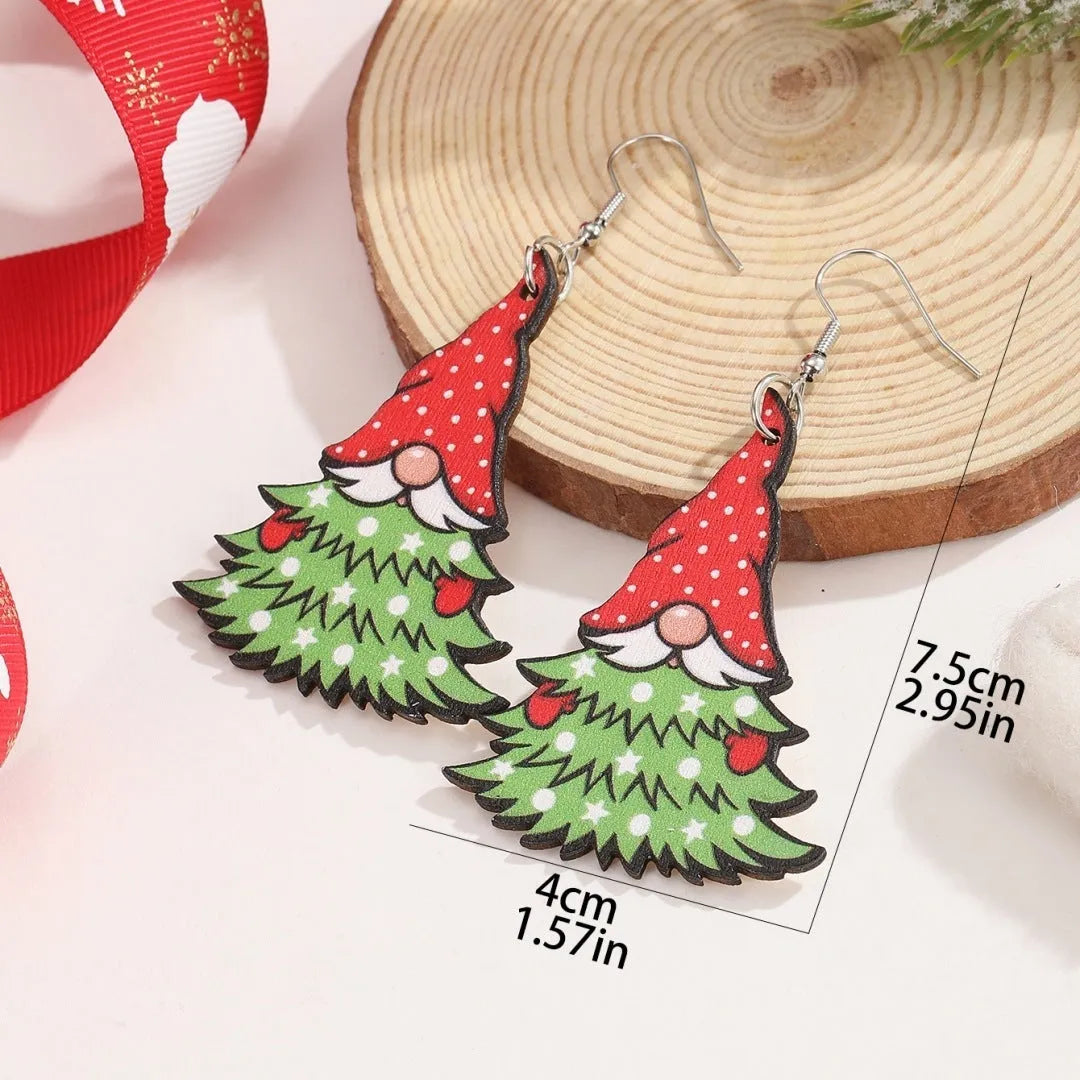 Wooden Christmas earrings with geometric shapes showing printed tree and snowman designs