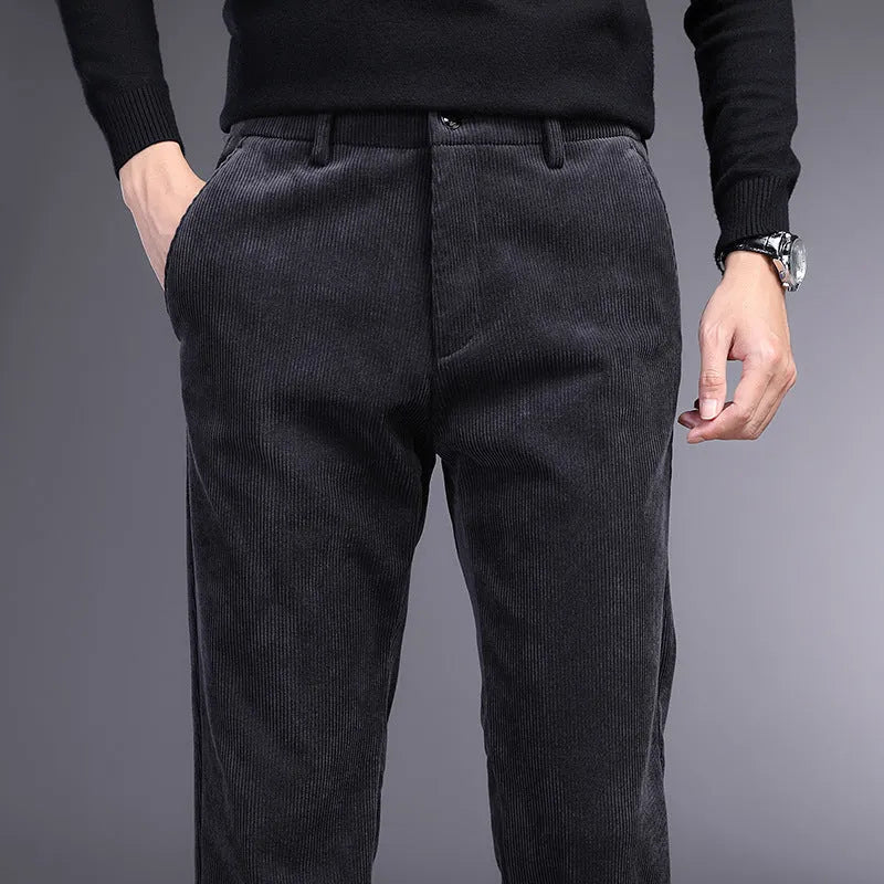 British retro striped straight-leg men's trousers in khaki colour on a hanger.