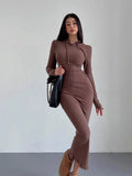 A woman modelling a grey hooded long sleeve sheath dress with a high waist.