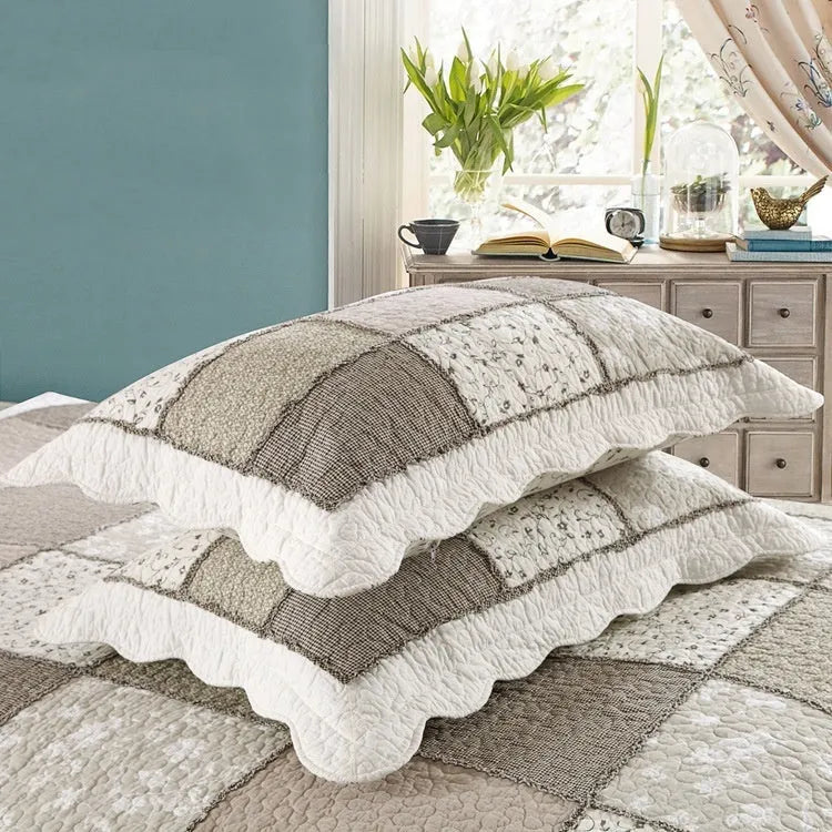 Pure cotton quilted bedspread and pillowcase three-piece set in a chosen colour pattern on a bed.
