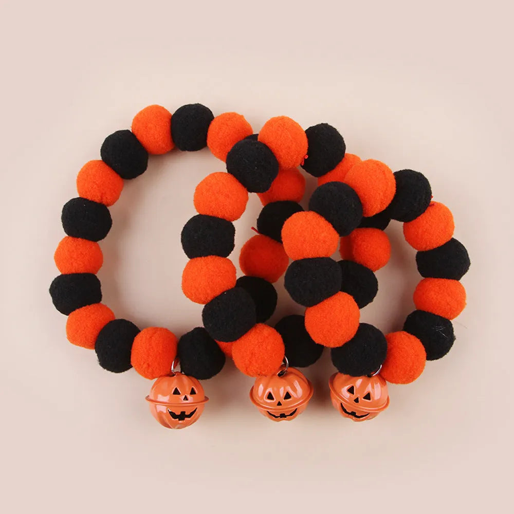Orange and black pumpkin-shaped adjustable cat collar for Halloween.