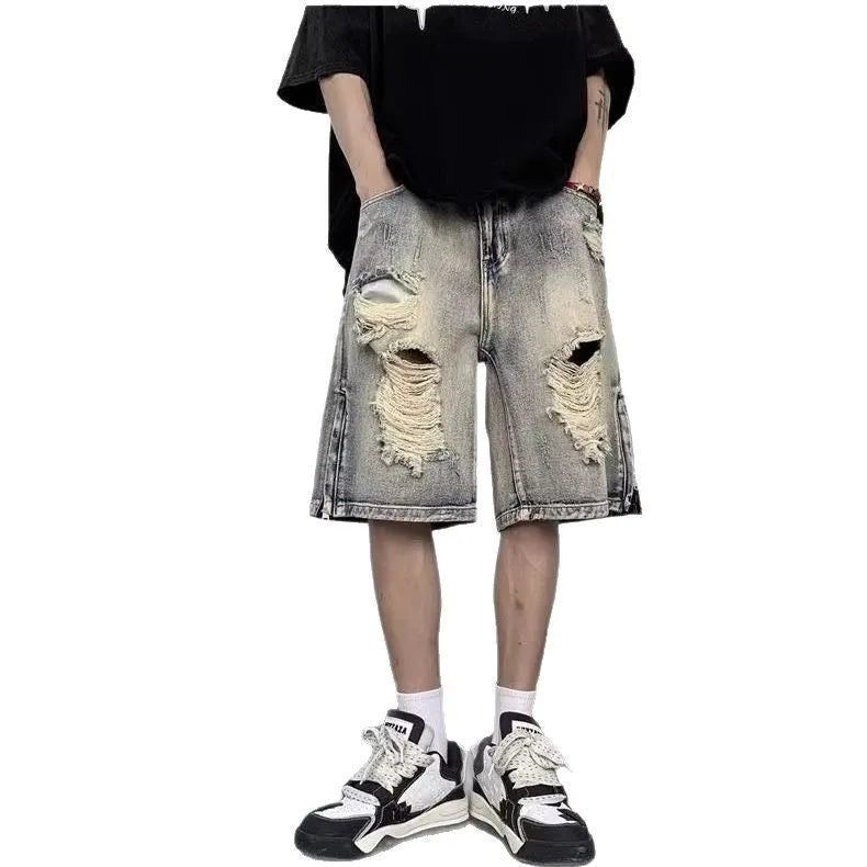 Blue retro denim shorts with tattered detailing and a wide leg loose fit