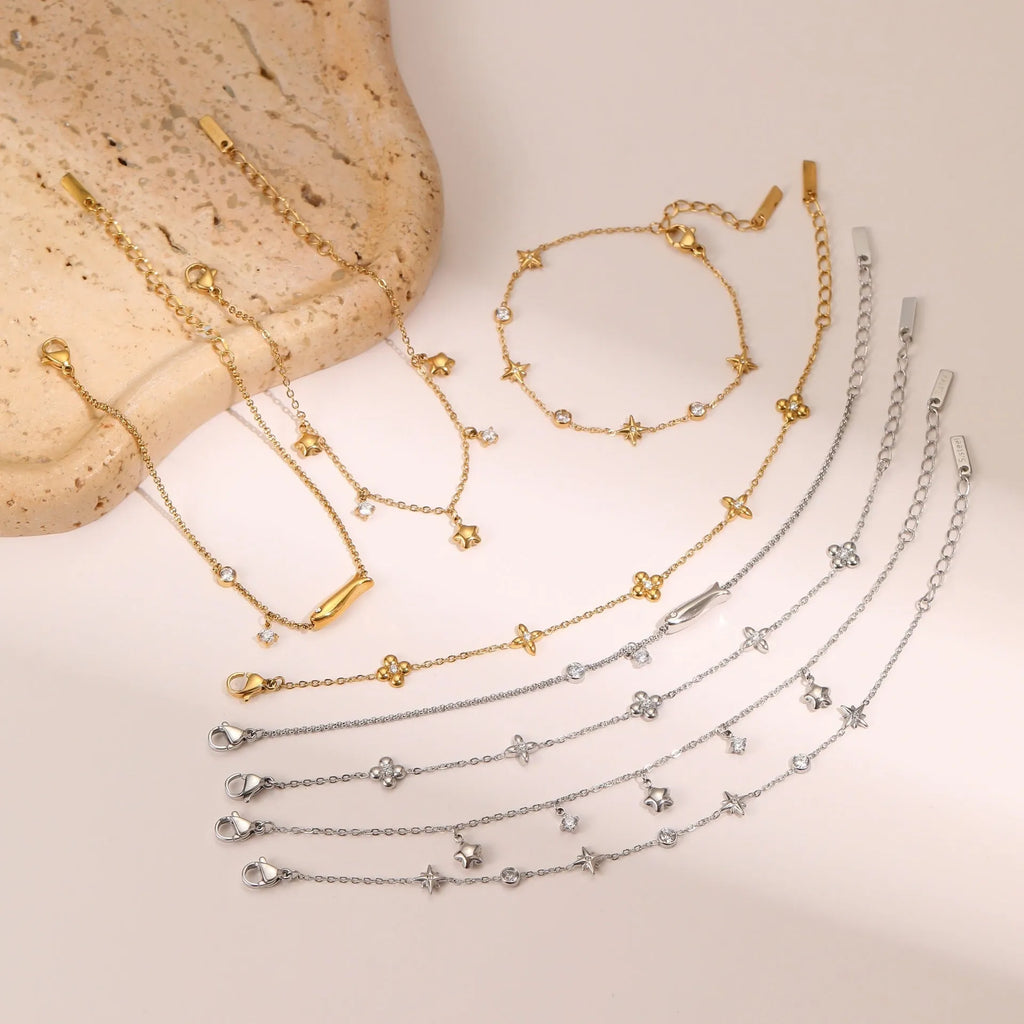 Women's titanium steel bracelet with 18K gold plating and a geometric hexagonal zircon star pendant.