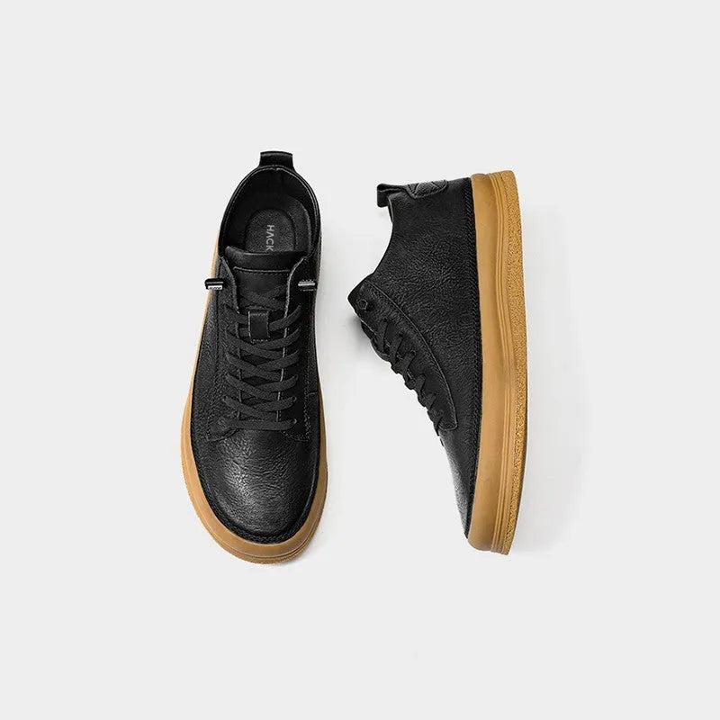 Men's black and white casual leather shoes with round toe, flat heel, and lanyard closure.