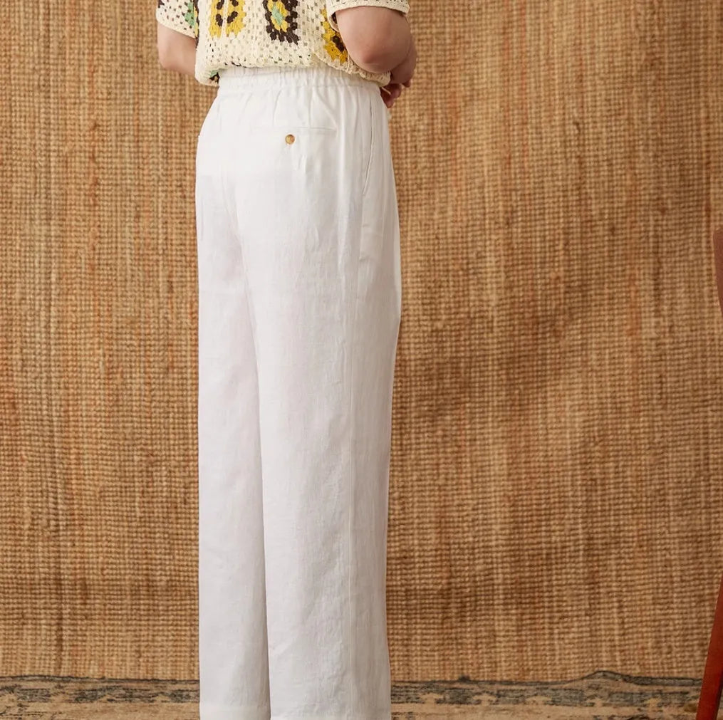 Women's linen casual trousers with elastic high waist and lace trim in navy blue, white, and greige colours