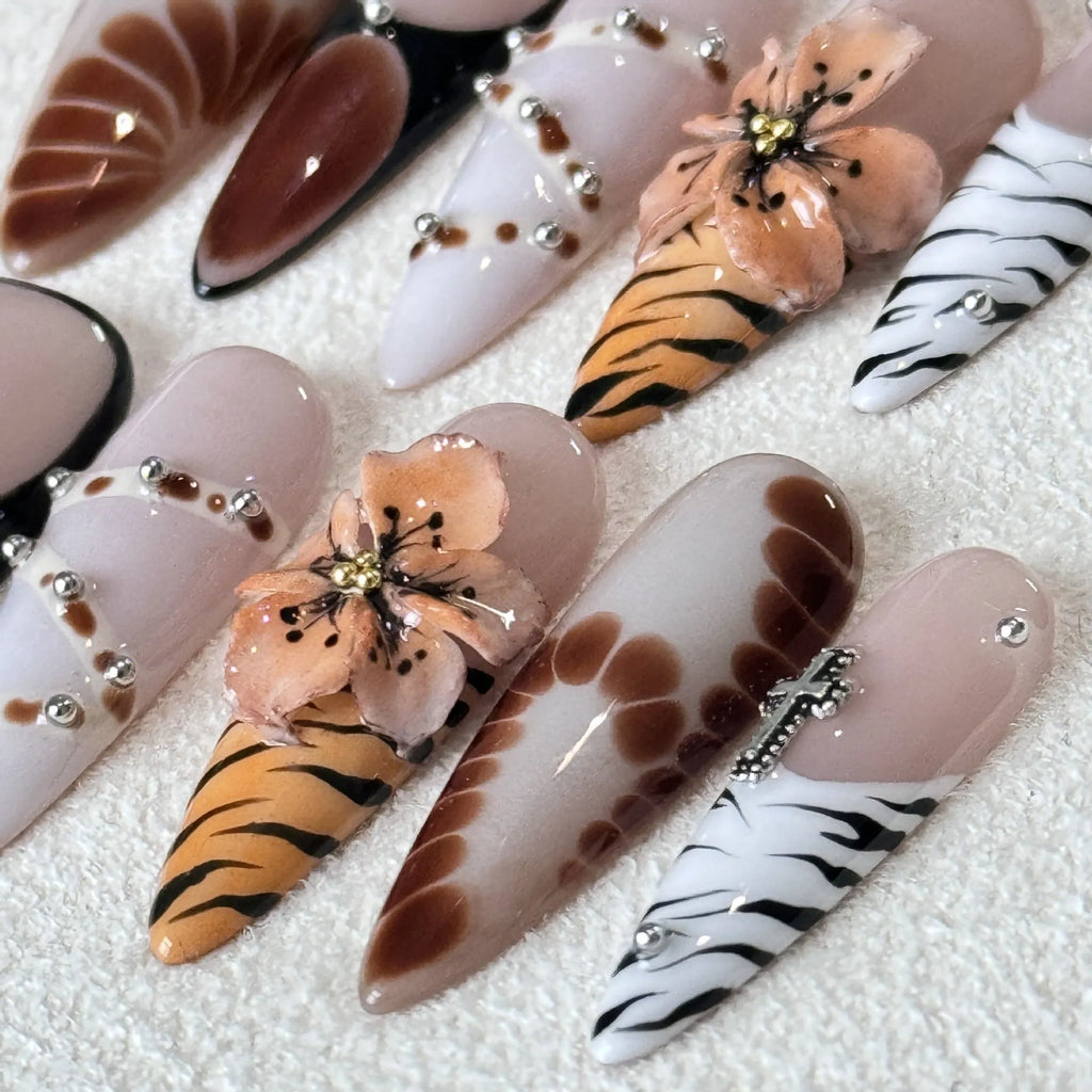 Handmade French style gel nail art stickers with leopard, cross and floral prints in four sizes.