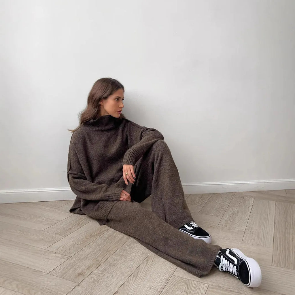 Women's acrylic two-piece suit with side-slit sweater top and matching trousers in dark grey