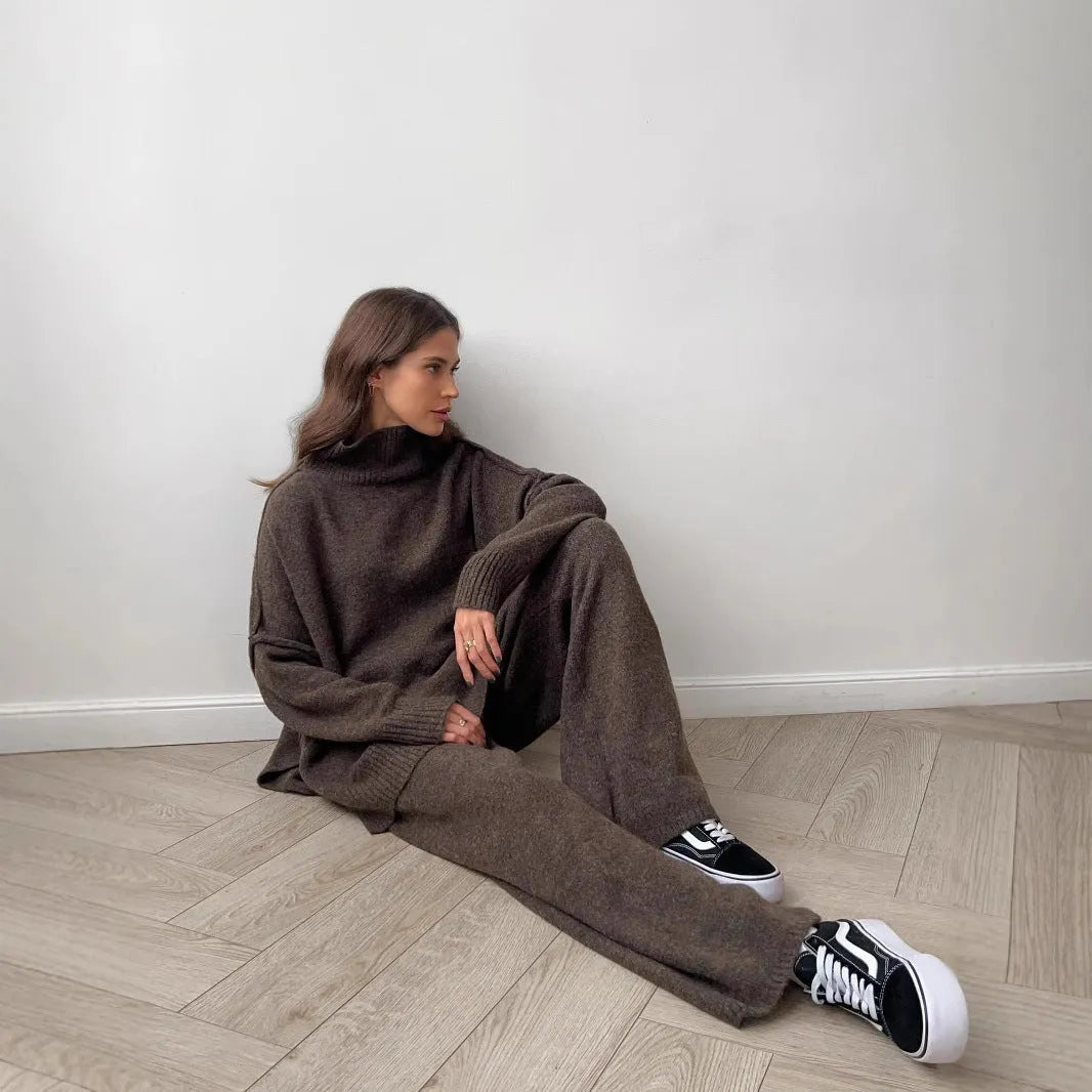 Women's acrylic two-piece suit with side-slit sweater top and matching trousers in dark grey