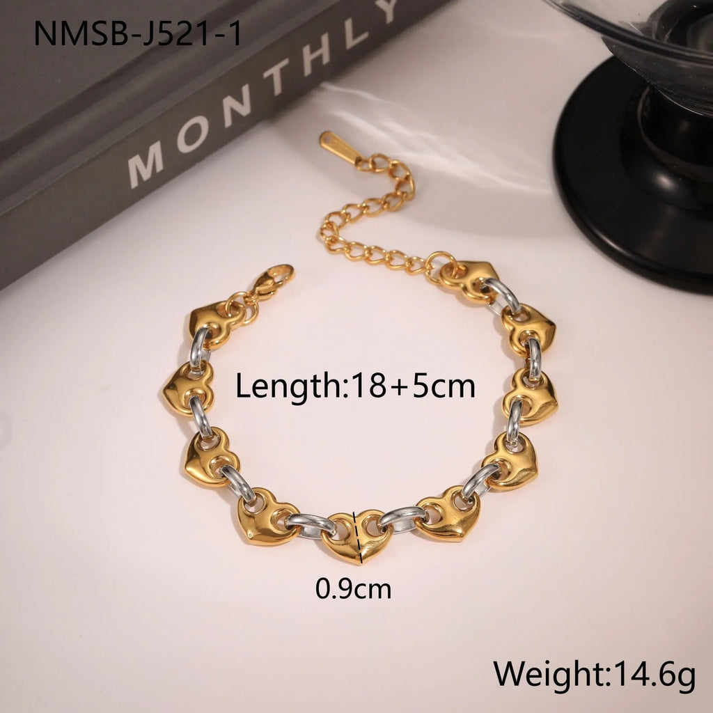 Hollowed-out heart bracelet in stainless steel with 18K gold plating, showing geometric design and electroplated finish