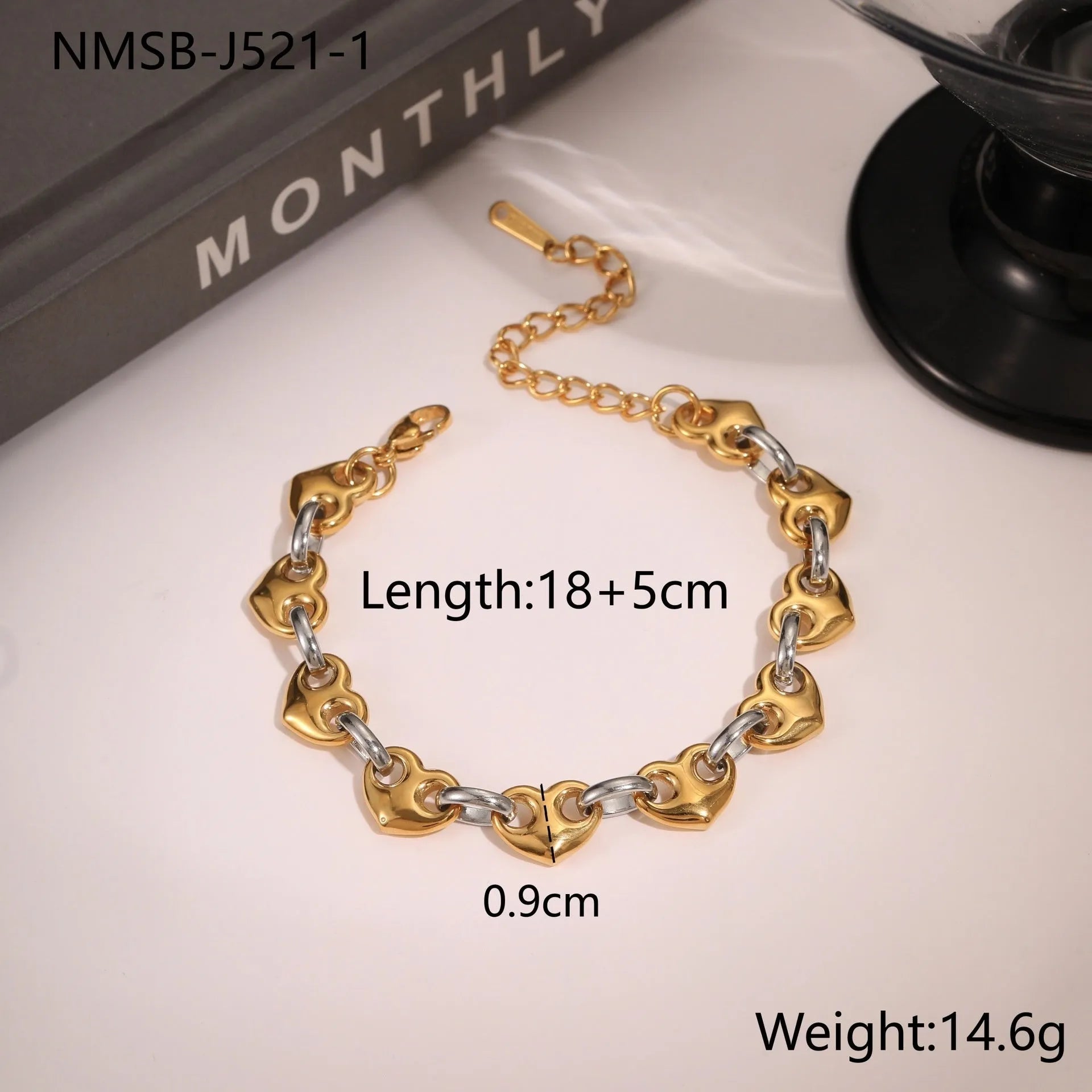 Hollowed-out heart bracelet in stainless steel with 18K gold plating, showing geometric design and electroplated finish