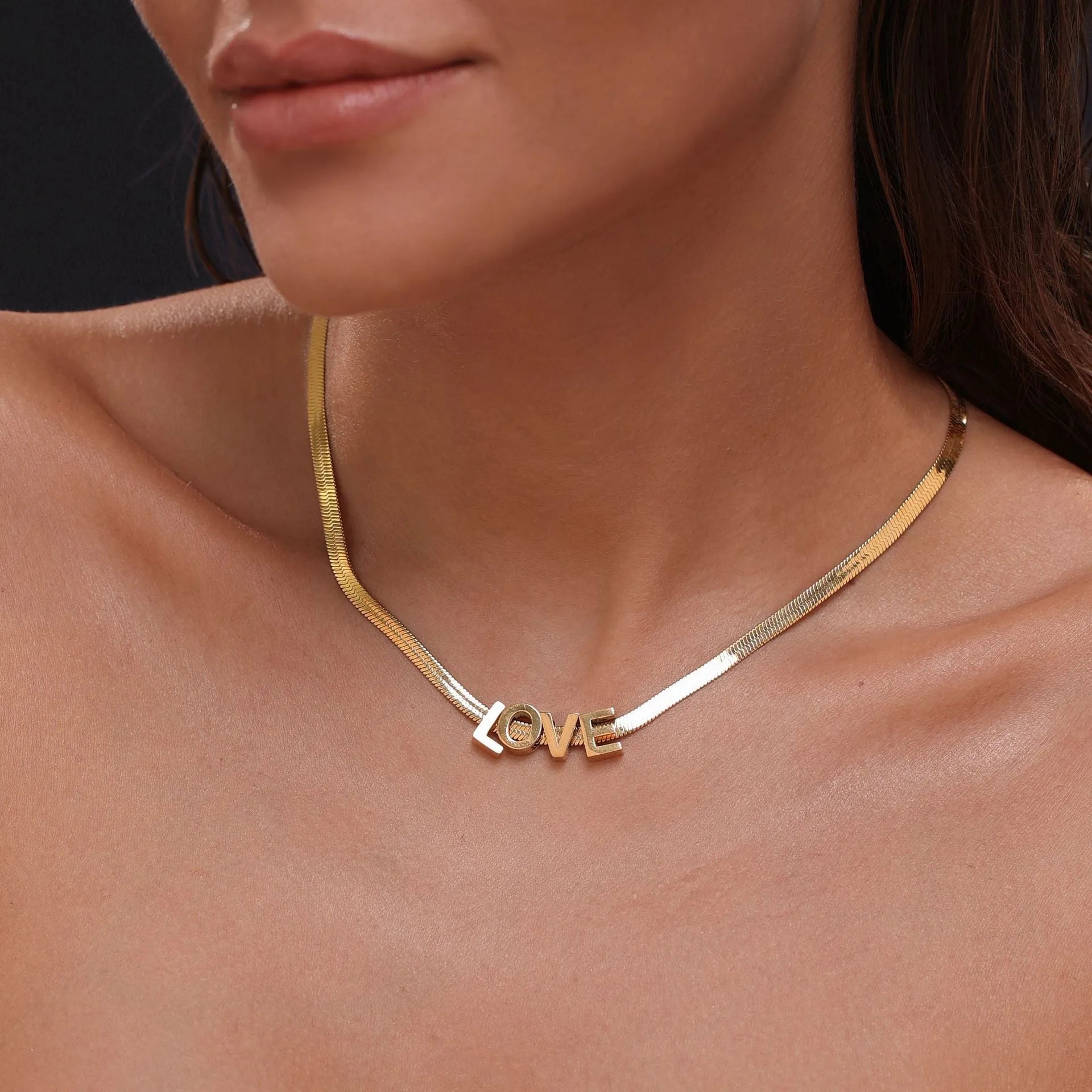 Gold and silver titanium steel personalised necklace showing number and letter pendant options on 40.5cm chain