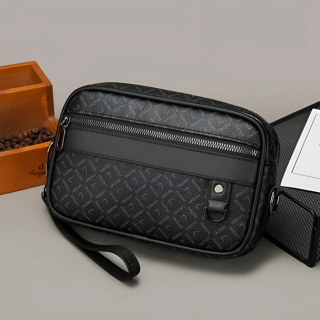 Men's black geometric pattern messenger bag shown in horizontal carrying position with shoulder strap