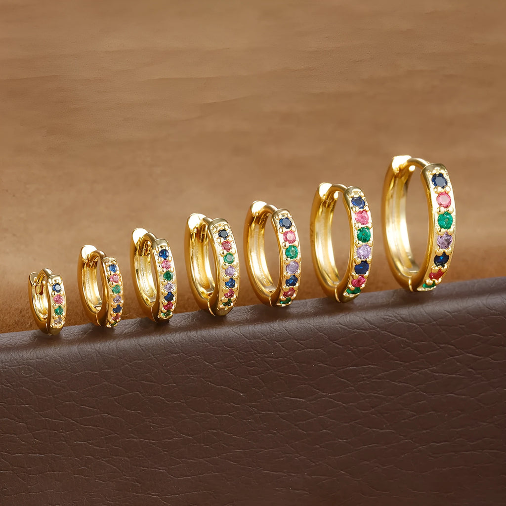 Perforated circle zircon stud earrings in gold colour with geometric pattern and butterfly clasp