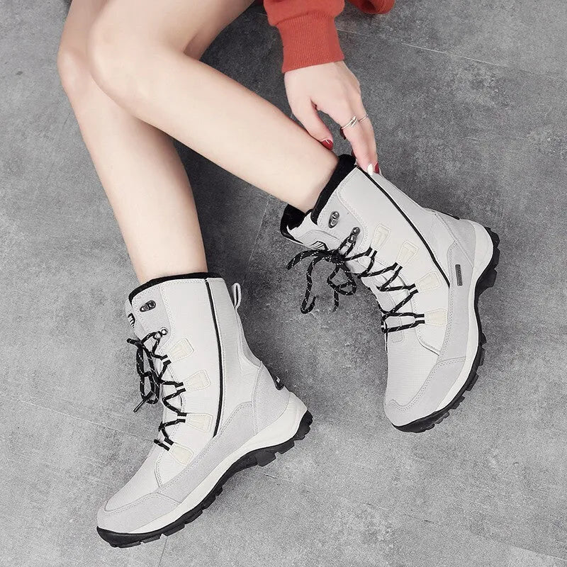 Women's genuine leather mid-calf snow boots in black with round toe and rubber non-slip sole