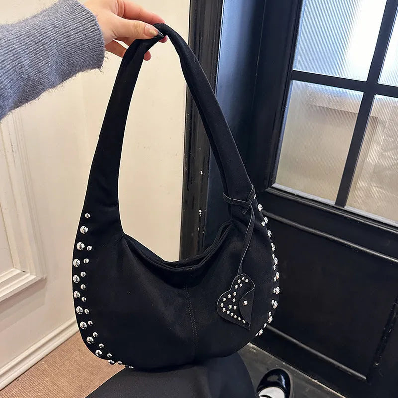 A soft plush retro style tote handbag for women in a strapless design, shown in a choice of colours.