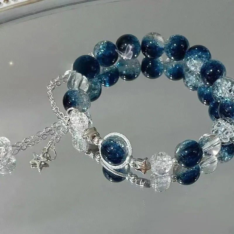 Chinese style handmade glass bead bracelet with bamboo joint elements on a white background.