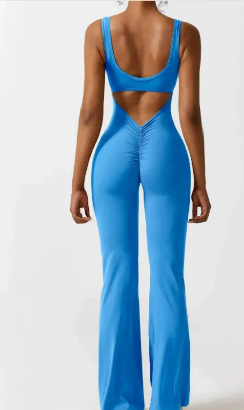 Women's black milk silk seamless yoga bodysuit with hollow design and mid waist.