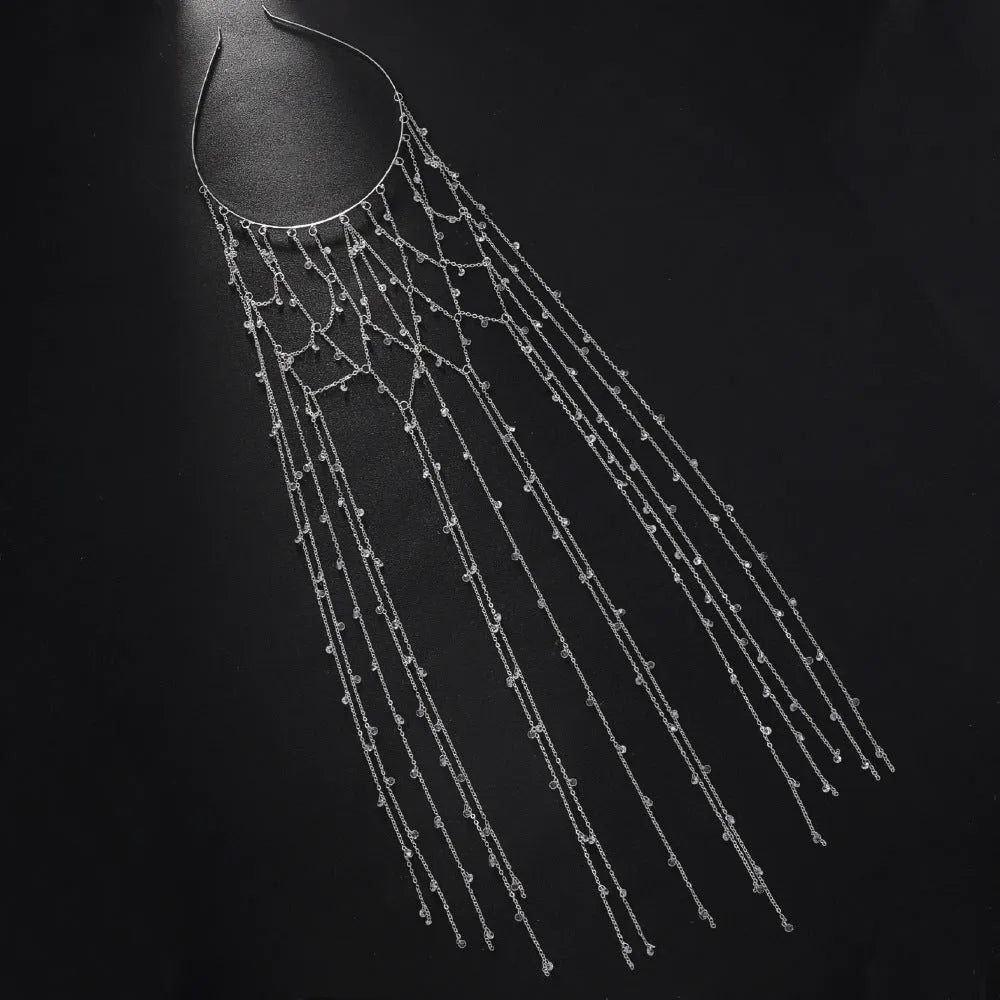 Gold and silver rhinestone headband with a sparkling electroplated finish and a long mesh tassel detail.