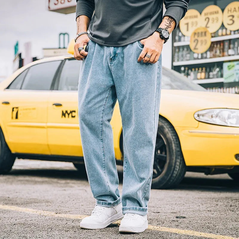 Men's loose straight jeans in dark blue, light blue, and grey colours showing mid waist and straight-leg cut