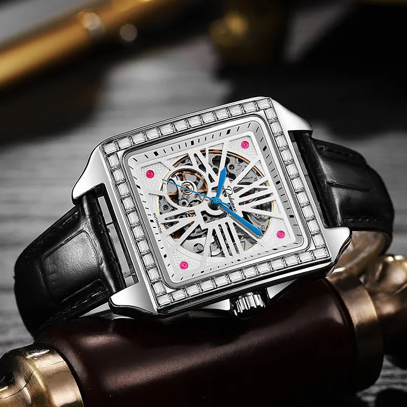Men's square-faced automatic watch with diamond-studded bezel on a black leather strap