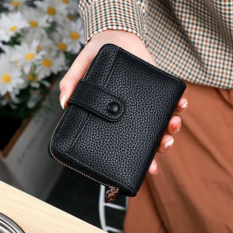 Beige women's short pu wallet with lychee pattern and sewing thread detail.