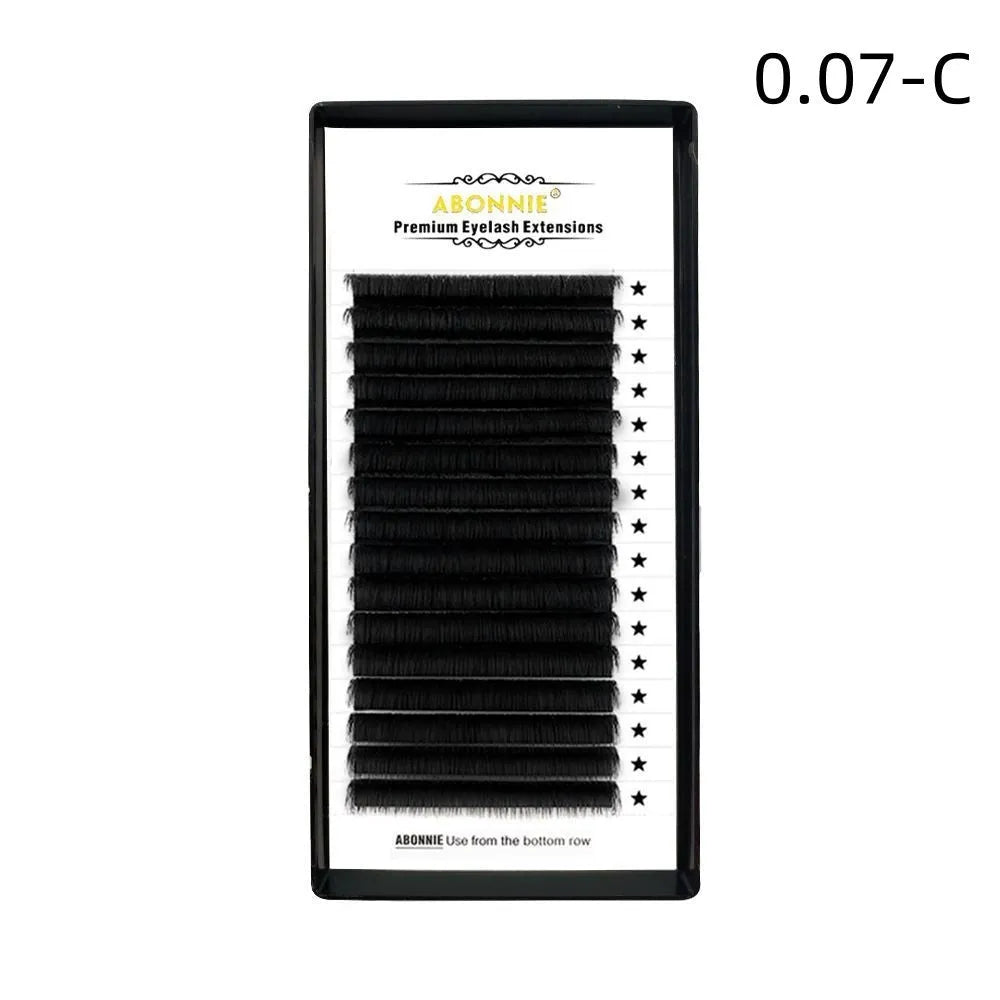 Dense 16-row mink hair false eyelashes on a white background, showing natural fibre texture.