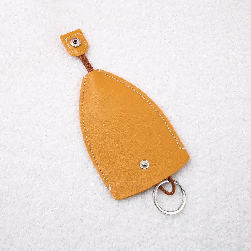 Colourful cartoon pull-out key case made from PU leather, showing the key extended from its protective sleeve.