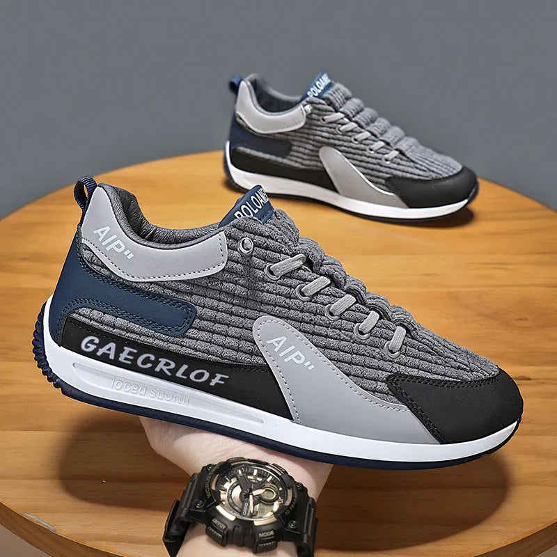 Men's grey and green mesh running shoes with low-top design and lace-up closure