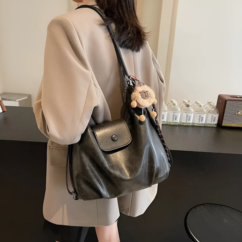 Women's black PU leather single shoulder bag with horizontal square shape and optional pendant attachment