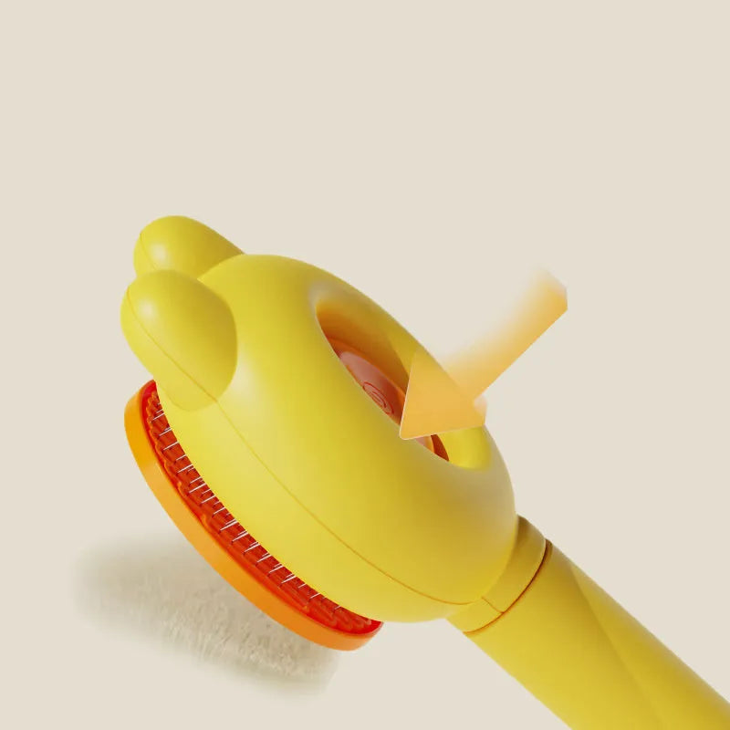 Green self-cleaning pet grooming brush with release button and stainless steel comb teeth.