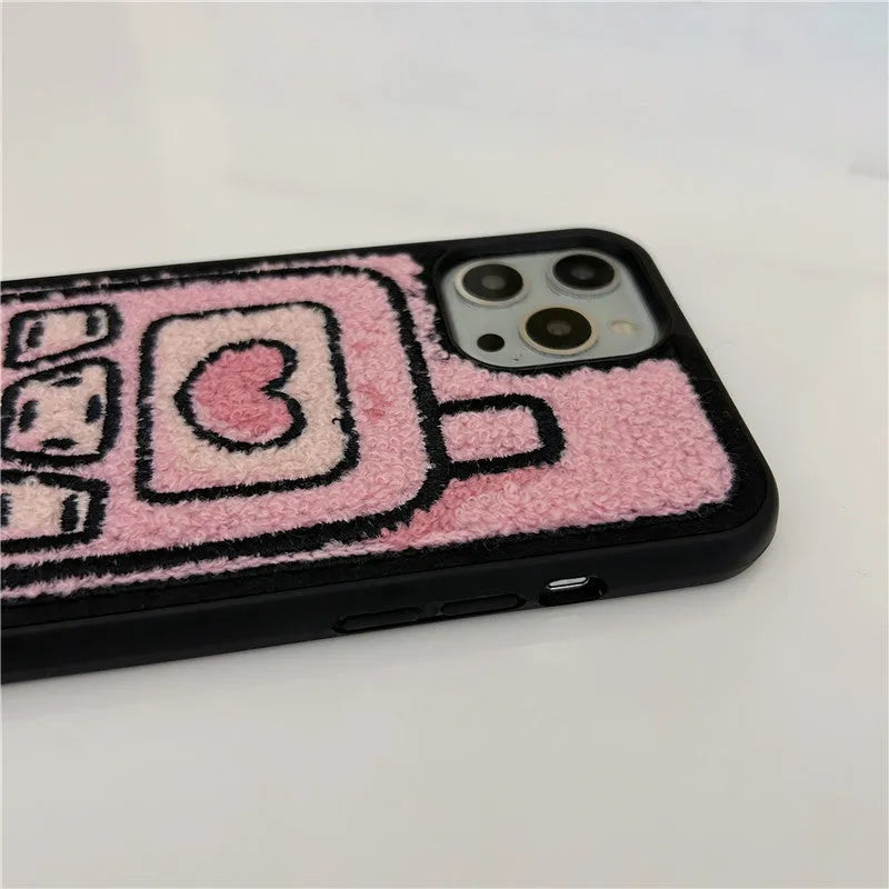 Pink TPU iPhone case with a raised towel embroidery texture on the back.