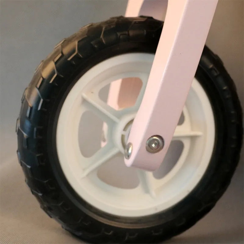 Pink wooden balance scooter for toddlers with 10-inch wheels