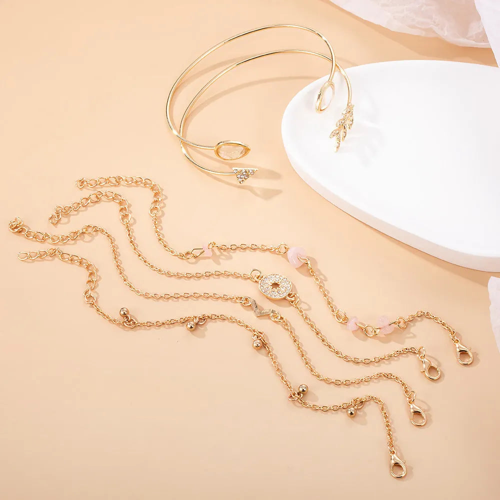 Gold zinc alloy bracelet set with water drop and arrow charms