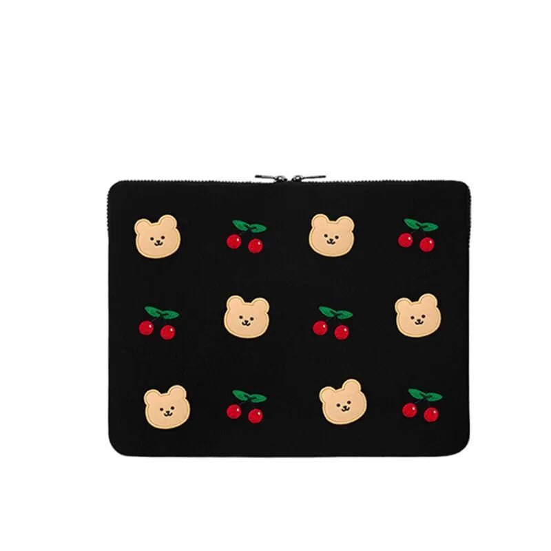 Embroidered laptop sleeve with animal design showing polyester construction and laptop size compatibility