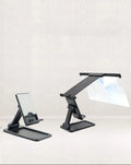 Black 12-inch curved mobile phone screen amplifier with separate folding phone holder on desktop