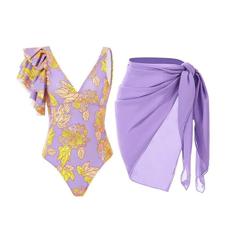 Women's solid colour one-piece swimsuit with spaghetti straps and an attached skirt.