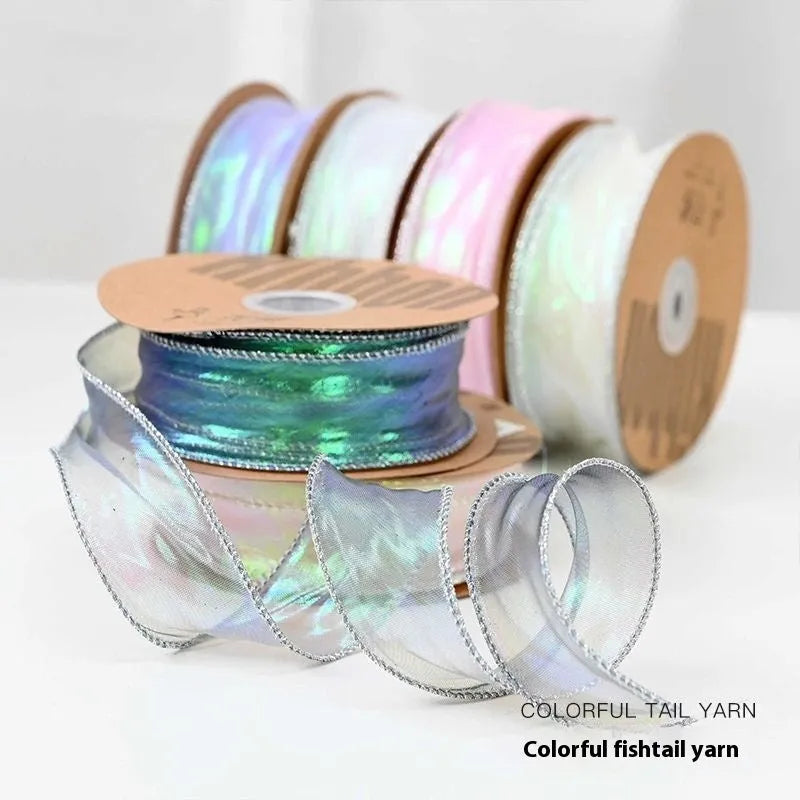 Fishtail yarn floral ribbon roll in mesh material with wave edge pattern measuring 4cm wide