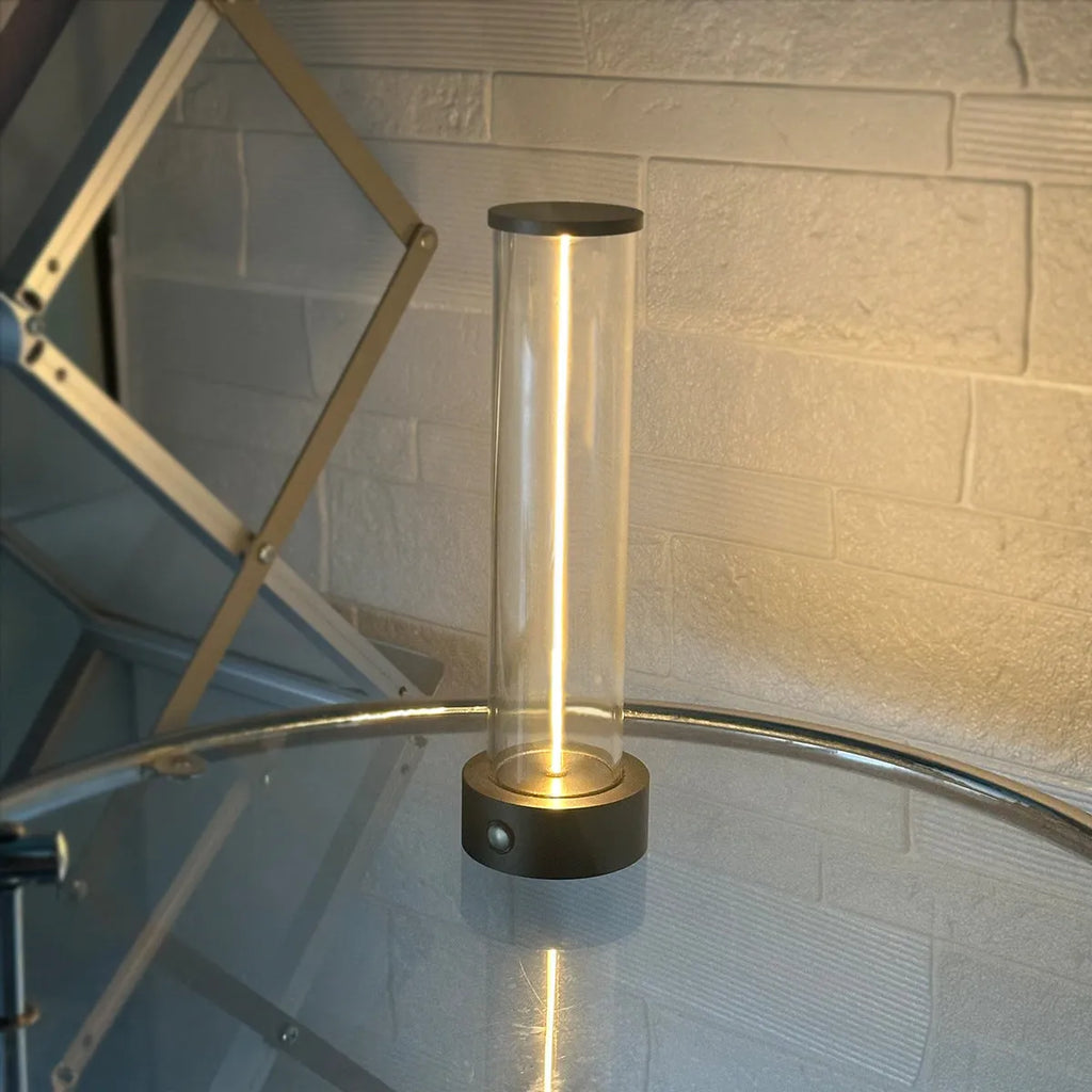 Slender LED glass light strip with magnetic mounting and USB charging cable