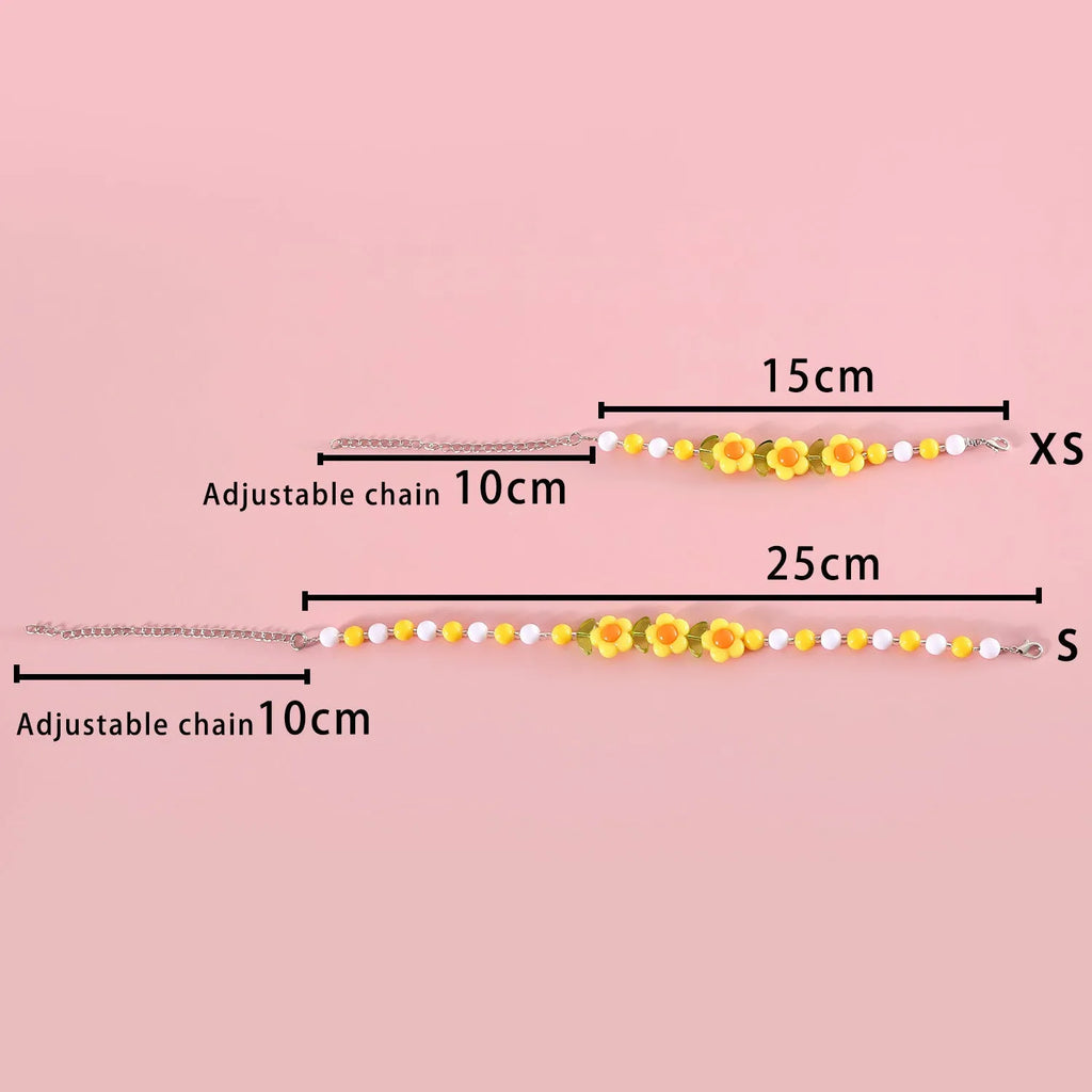 Colourful plastic bead cat necklace with adjustable sizing in peach, rainbow, and small flower patterns