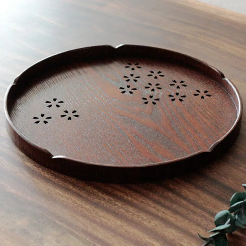 Wooden round plate with hollow cherry blossom pattern, 30 cm diameter.