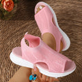 Women's flat black platform sports sandals with mesh lining and a thick rubber sole.