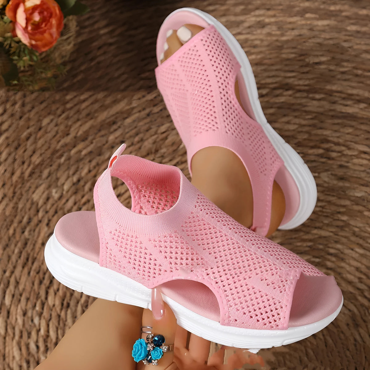 Women's flat black platform sports sandals with mesh lining and a thick rubber sole.