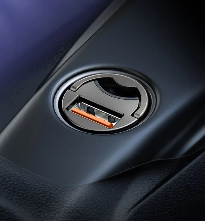 Grey Baseus 30W single USB car charger with 1 metre cable on a car dashboard