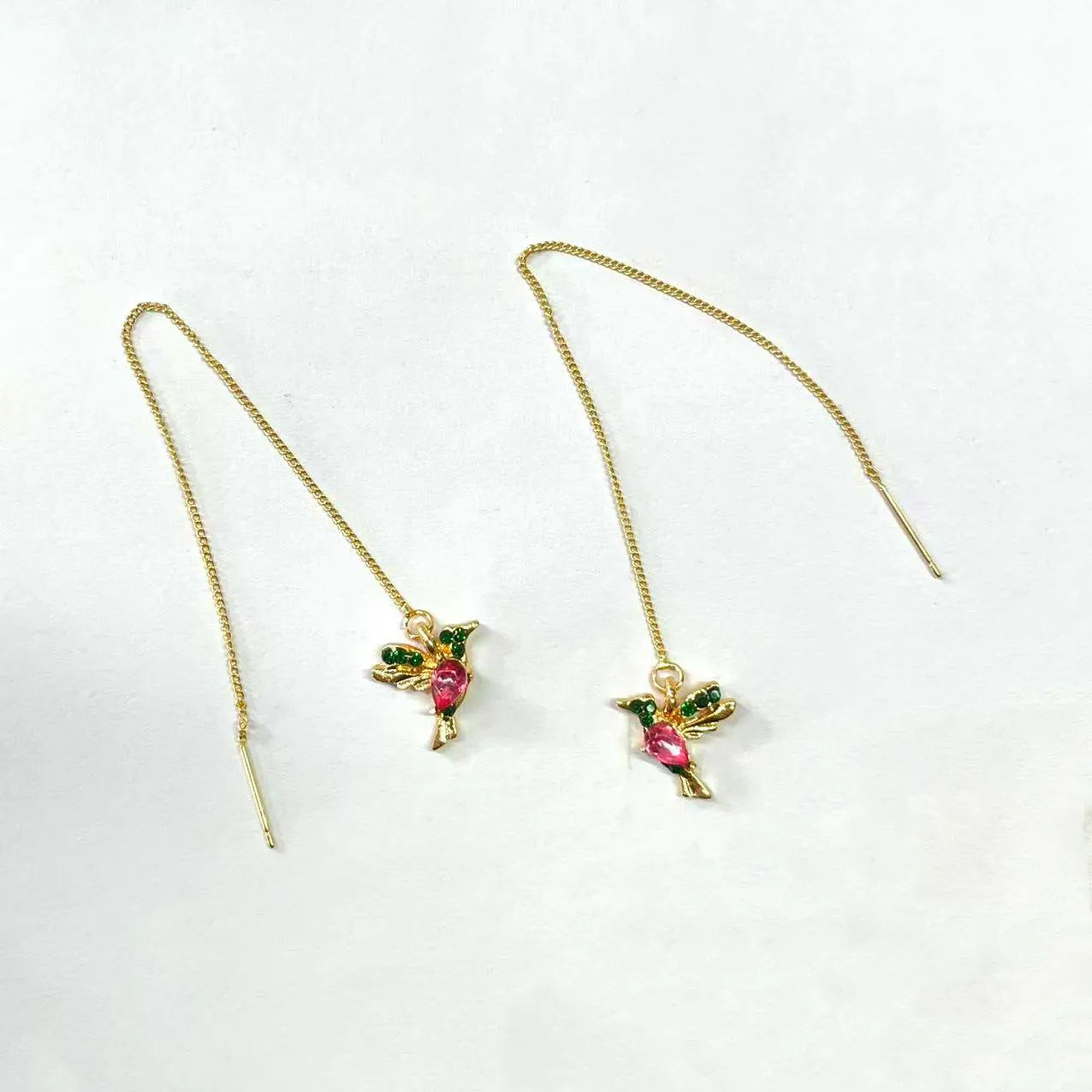 Women's long drop earrings with hanging bird pendants and zirconium crystal accents in blue colour option