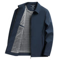 Man wearing a solid khaki loose-fit polo collar casual jacket with side pockets.