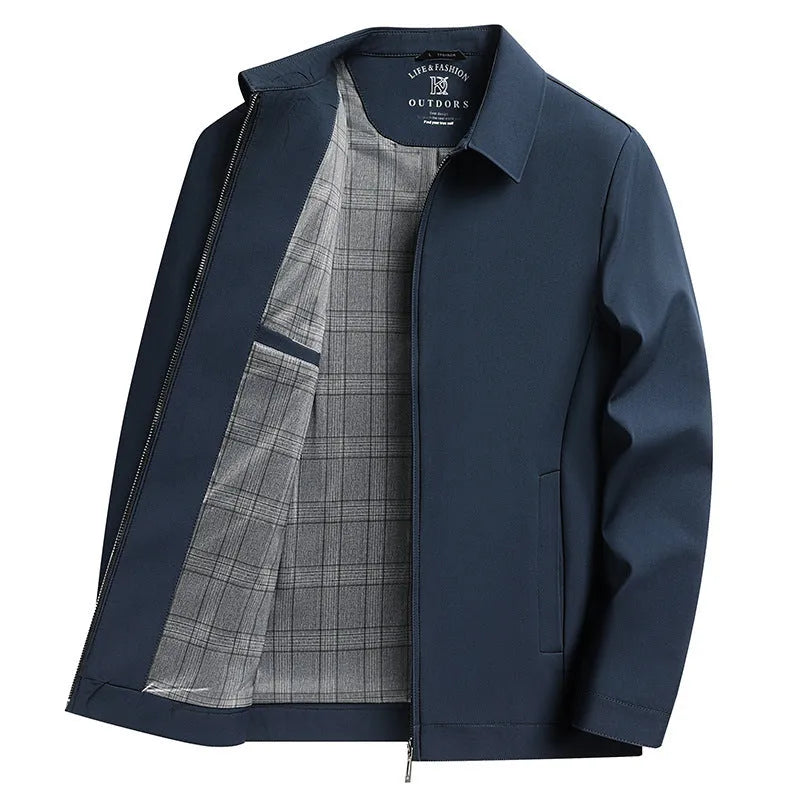 Man wearing a solid khaki loose-fit polo collar casual jacket with side pockets.